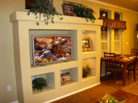 Full finished drywall, with residential style entertainment center.