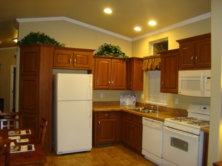 Ample and appealing Kitchen was shown with wrapped MDF cabinetry.