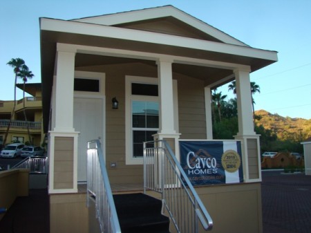 Covered front porch on this manufactured home community friendly designed home.